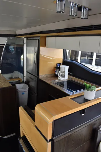  Yacht Photos Pics 2018 Azimut Flybridge yacht kitchen interior with modern appliances and sleek design.