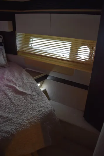  Yacht Photos Pics 2018 Azimut Flybridge interior cabin with bed and window blinds.