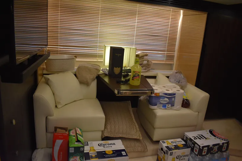  Yacht Photos Pics Interior of 2018 Azimut Flybridge yacht with supplies and beverages on seating area.