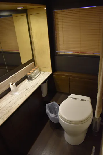  Yacht Photos Pics 2018 Azimut Flybridge yacht bathroom with modern fixtures and wooden accents.