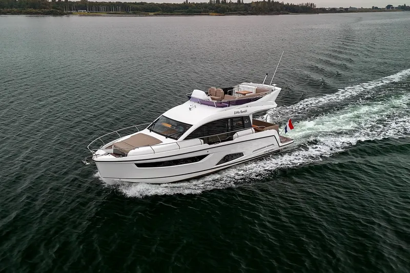  Yacht Photos Pics 2021 Sealine F430 yacht cruising on open water, showcasing sleek design and luxury features.