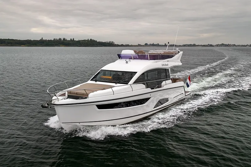  Yacht Photos Pics 2021 Sealine F430 yacht cruising on open water under cloudy skies.