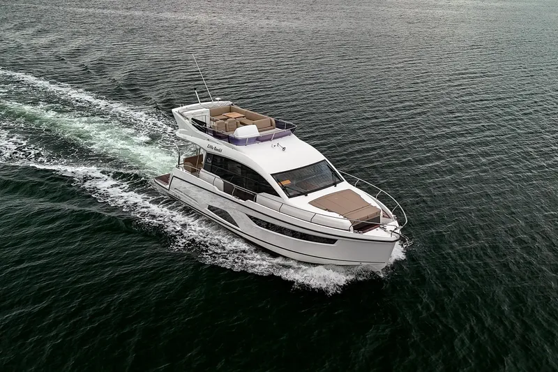  Yacht Photos Pics 2021 Sealine F430 yacht cruising on open water, showcasing sleek design and luxury features.