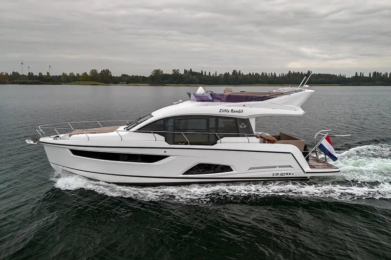  Yacht Photos Pics 2021 Sealine F430 yacht cruising on a calm lake under cloudy skies.