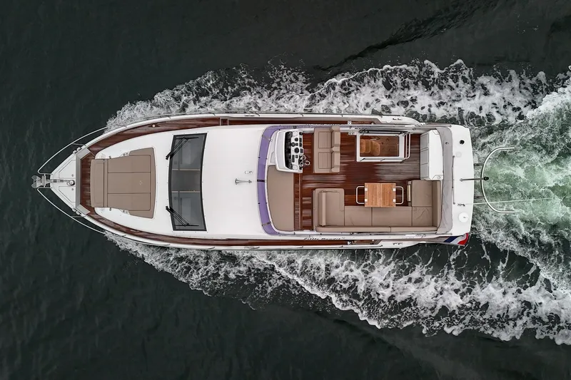  Yacht Photos Pics Aerial view of 2021 Sealine F430 yacht cruising on water.
