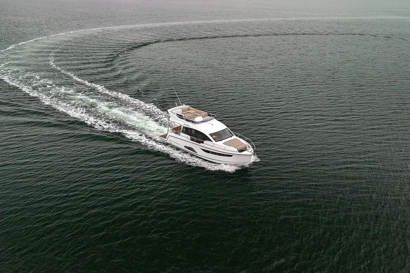  Yacht Photos Pics 2021 Sealine F430 yacht cruising on open water, creating a smooth wake.