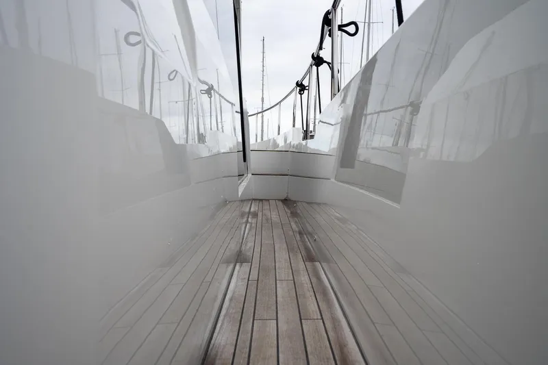  Yacht Photos Pics 2021 Sealine F430 yacht deck with sleek reflective surfaces and wooden flooring.