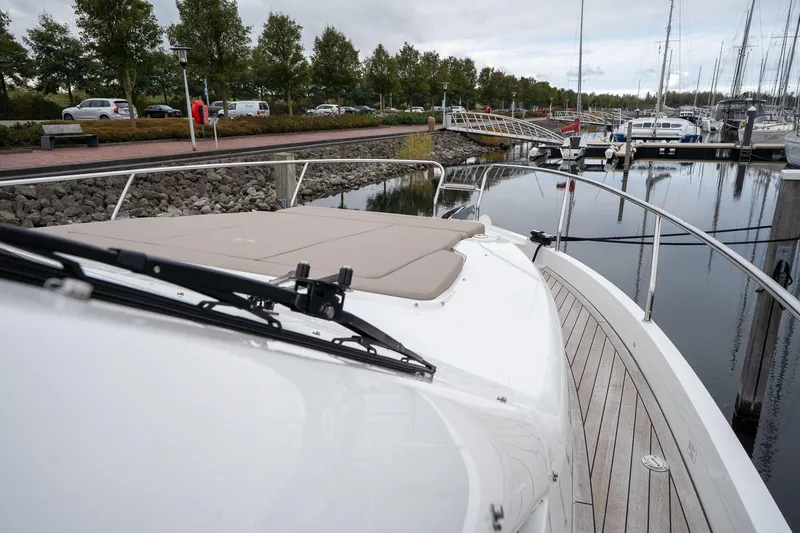  Yacht Photos Pics 2021 Sealine F430 yacht docked at marina, showcasing sleek deck design and luxurious features.