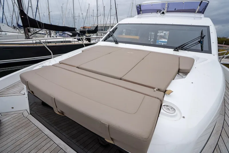  Yacht Photos Pics 2021 Sealine F430 yacht with spacious sunbed on deck, docked at marina.