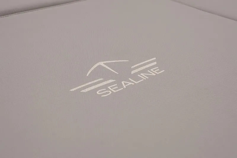  Yacht Photos Pics Sealine F430 2021 logo on gray fabric background, showcasing luxury yacht branding.