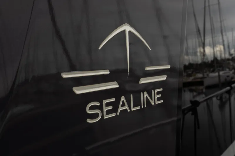  Yacht Photos Pics Sealine F430 2021 yacht logo on dark hull background at marina.