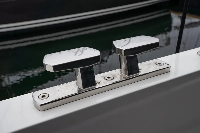  Yacht Photos Pics Stainless steel cleats on 2021 Sealine F430 yacht, docked by the water.