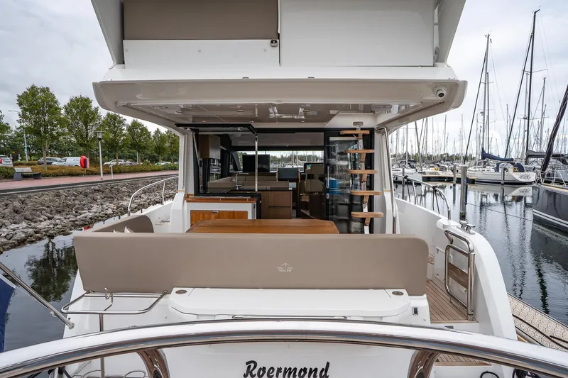  Yacht Photos Pics 2021 Sealine F430 yacht at marina, showcasing spacious deck and modern interior design.