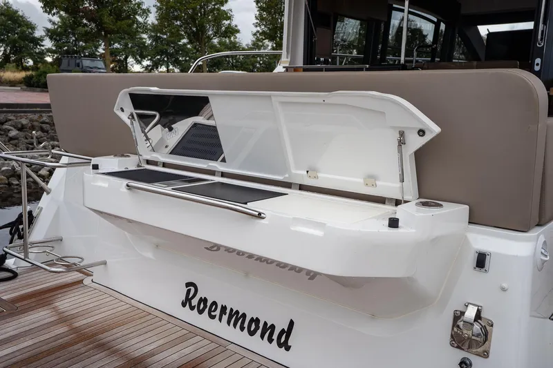  Yacht Photos Pics 2021 Sealine F430 yacht with open storage compartment, wooden deck, and sleek design.