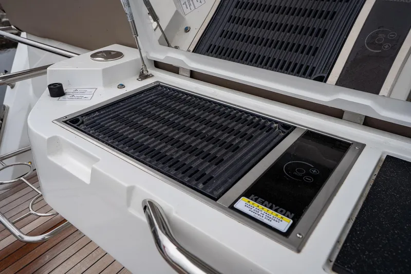  Yacht Photos Pics Outdoor grill on 2021 Sealine F430 yacht deck, featuring Kenyon electric cooktop.