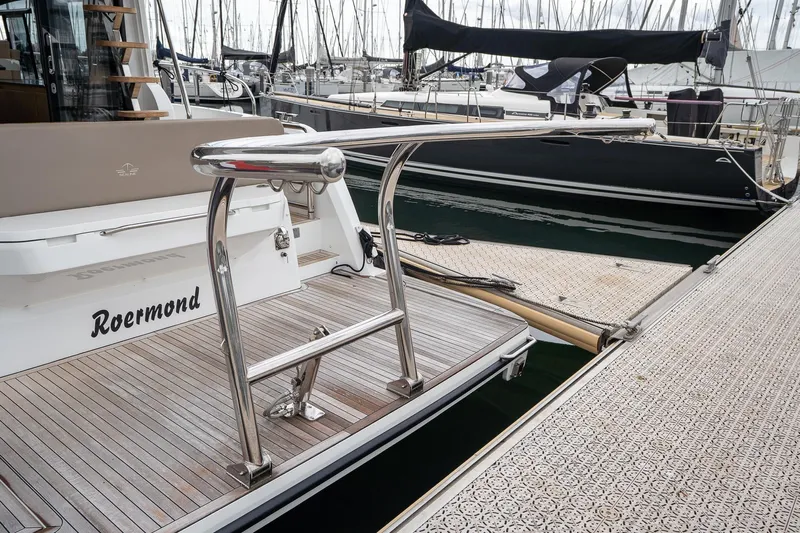  Yacht Photos Pics 2021 Sealine F430 yacht docked at marina with wooden deck and stainless steel railings.