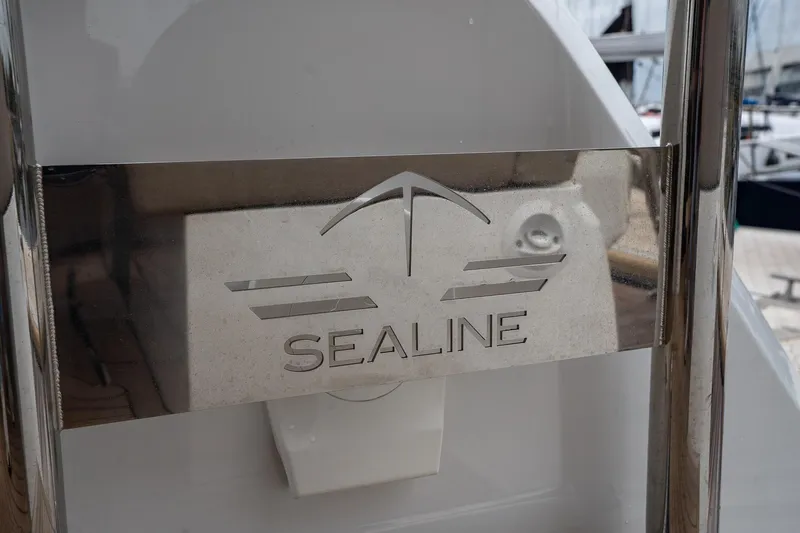  Yacht Photos Pics Sealine F430 2021 yacht logo on metallic surface, showcasing luxury boat branding.