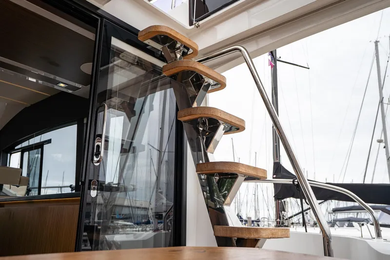  Yacht Photos Pics Staircase on 2021 Sealine F430 yacht with marina view in background.