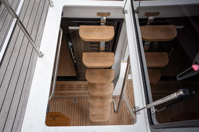  Yacht Photos Pics Staircase on 2021 Sealine F430 yacht, featuring wooden steps and sleek design.