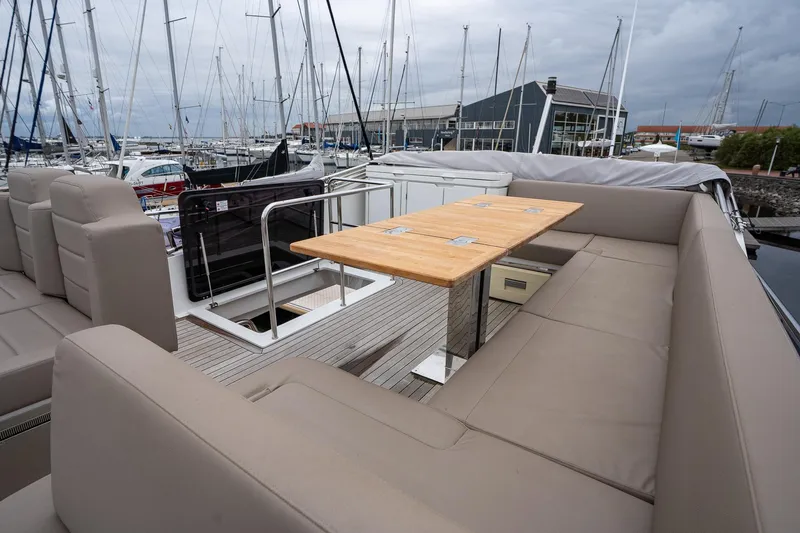  Yacht Photos Pics Luxurious 2021 Sealine F430 yacht deck with seating and table, docked at marina.