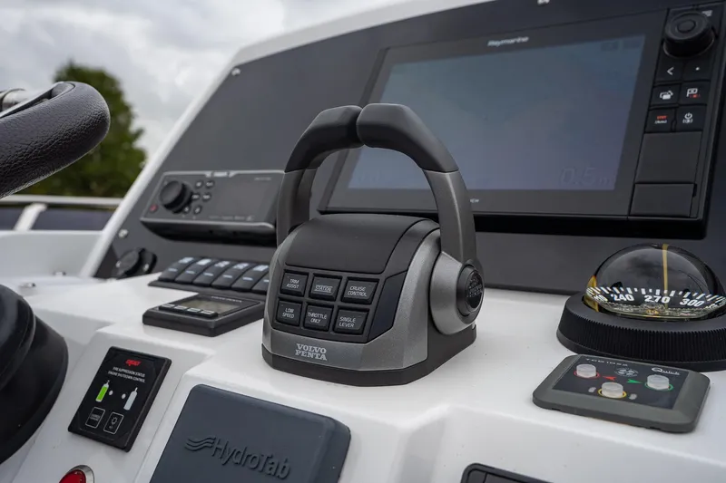  Yacht Photos Pics Control panel of 2021 Sealine F430 yacht featuring Volvo Penta throttle and navigation instruments.