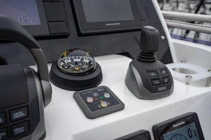  Yacht Photos Pics Control panel of 2021 Sealine F430 yacht featuring compass and Volvo Penta joystick.