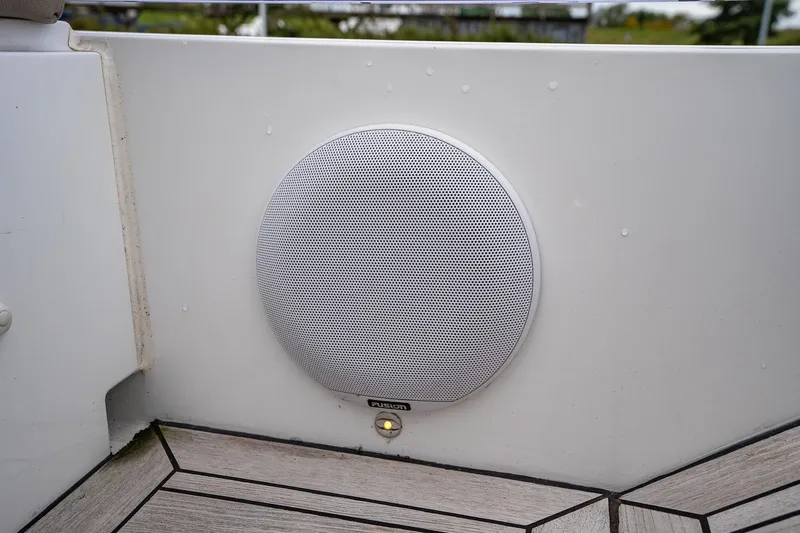  Yacht Photos Pics White speaker on 2021 Sealine F430 yacht deck, featuring modern design and wood flooring.