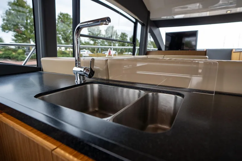  Yacht Photos Pics Luxury kitchen sink on 2021 Sealine F430 yacht, featuring modern design and sleek fixtures.