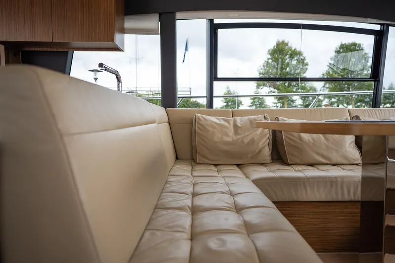  Yacht Photos Pics Luxurious interior of 2021 Sealine F430 yacht with plush seating and large windows.