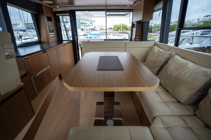  Yacht Photos Pics Luxurious interior of 2021 Sealine F430 yacht with elegant wood and leather seating.
