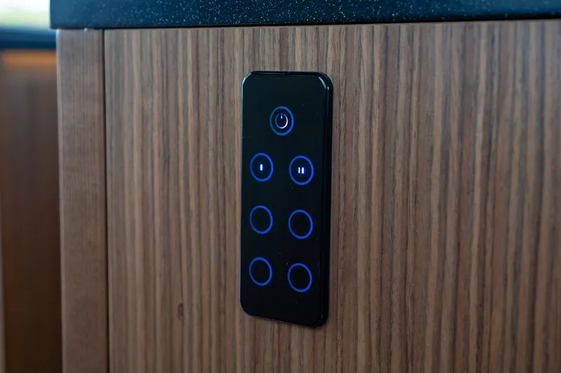  Yacht Photos Pics Touch control panel on 2021 Sealine F430 yacht's wooden interior.