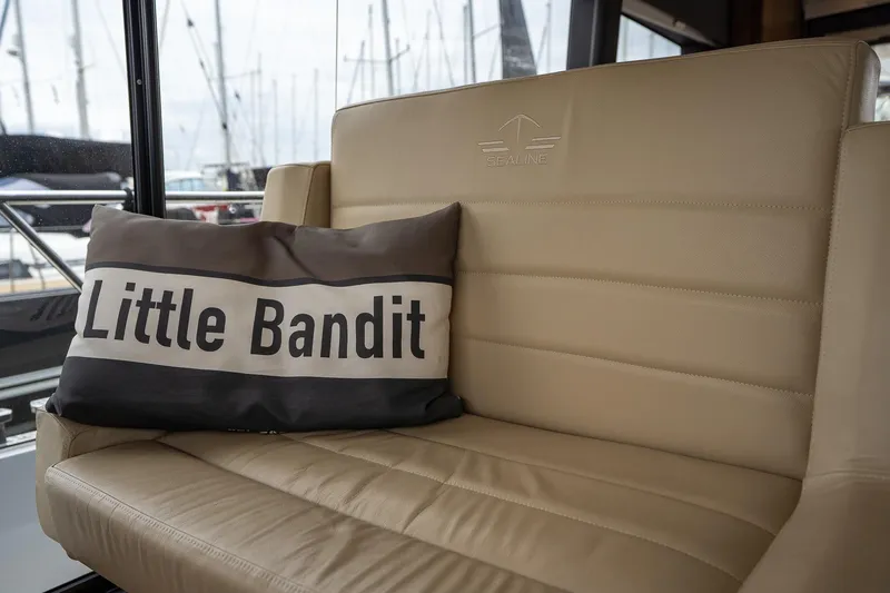  Yacht Photos Pics Beige leather seating on 2021 Sealine F430 yacht with "Little Bandit" pillow.