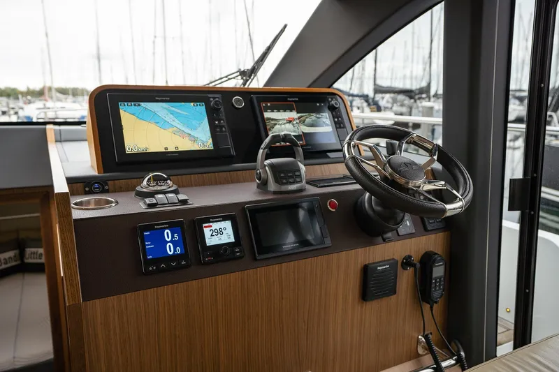  Yacht Photos Pics Helm of 2021 Sealine F430 yacht with navigation screens and steering wheel.