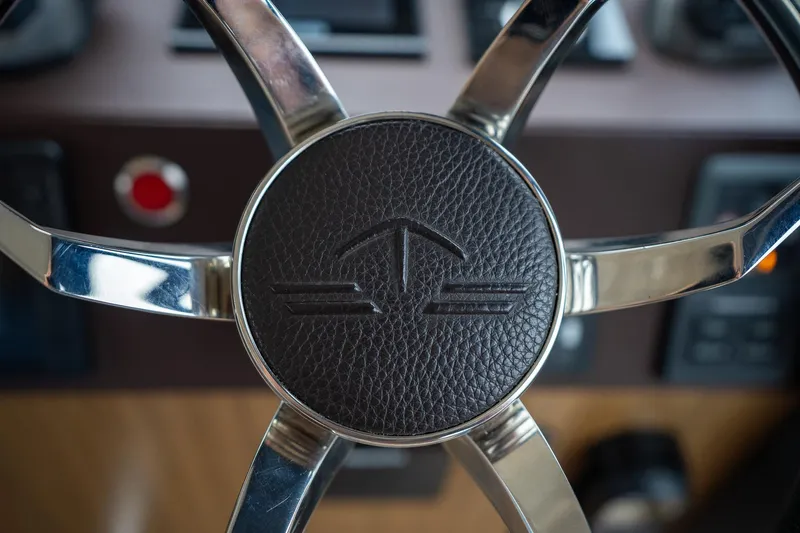  Yacht Photos Pics Steering wheel of 2021 Sealine F430 yacht with leather and chrome details.