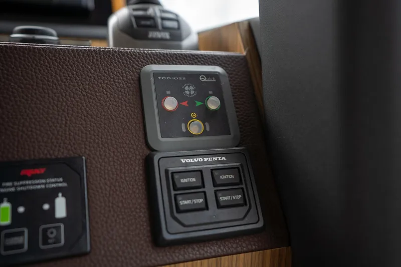  Yacht Photos Pics Control panel of a 2021 Sealine F430 yacht featuring Volvo Penta ignition and start/stop buttons.