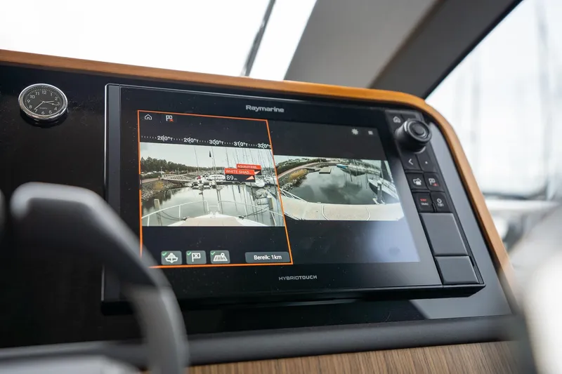  Yacht Photos Pics Raymarine navigation display on 2021 Sealine F430 yacht dashboard, showing marina view.