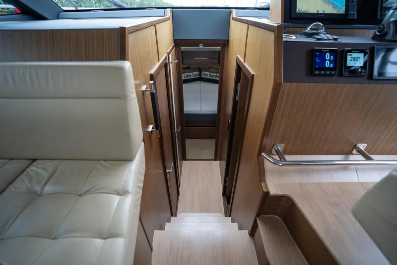  Yacht Photos Pics Interior of 2021 Sealine F430 yacht with wooden finishes and modern navigation equipment.
