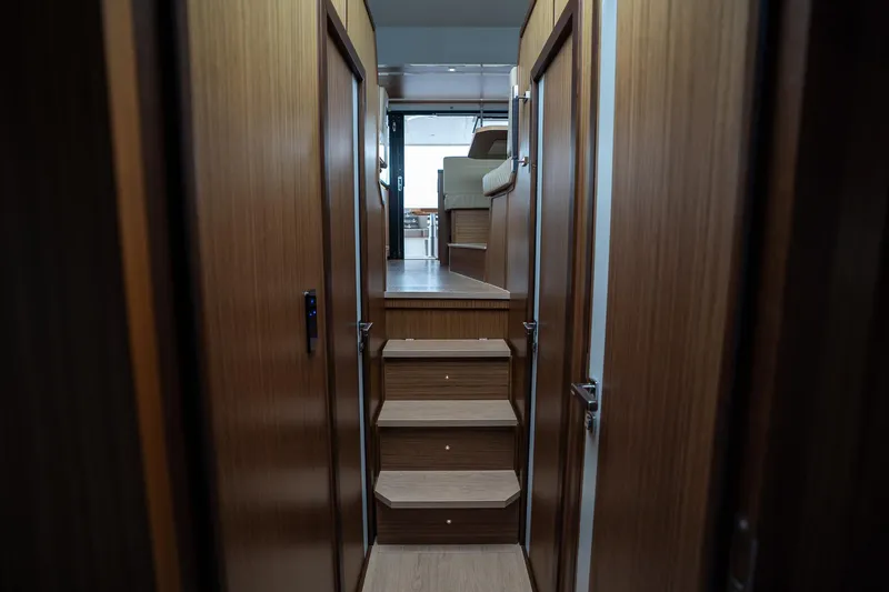  Yacht Photos Pics 2021 Sealine F430 yacht interior with wooden stairs and modern design.