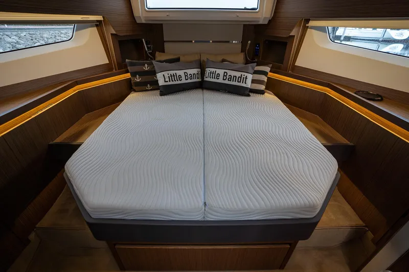  Yacht Photos Pics Luxurious 2021 Sealine F430 yacht cabin with stylish bedding and ambient lighting.