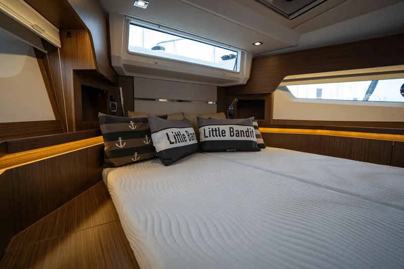  Yacht Photos Pics Luxurious cabin interior of 2021 Sealine F430 yacht with stylish bedding and cushions.