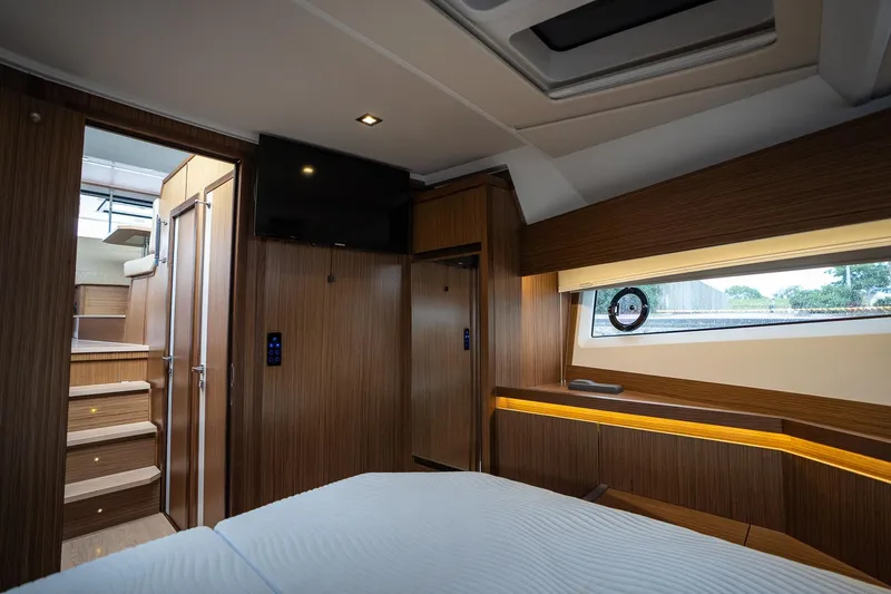  Yacht Photos Pics Luxurious interior of 2021 Sealine F430 yacht with wood paneling and modern amenities.