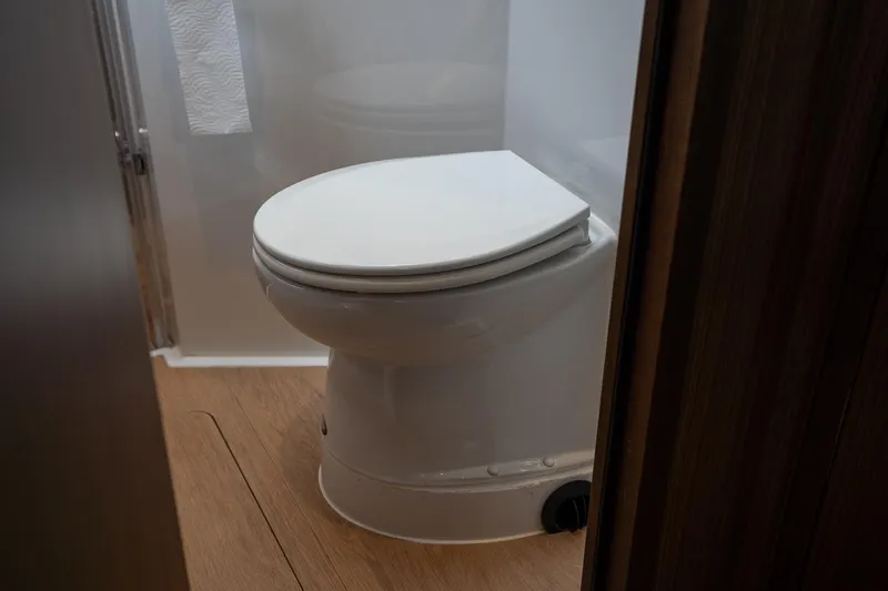  Yacht Photos Pics Toilet in 2021 Sealine F430 yacht bathroom with wooden flooring.