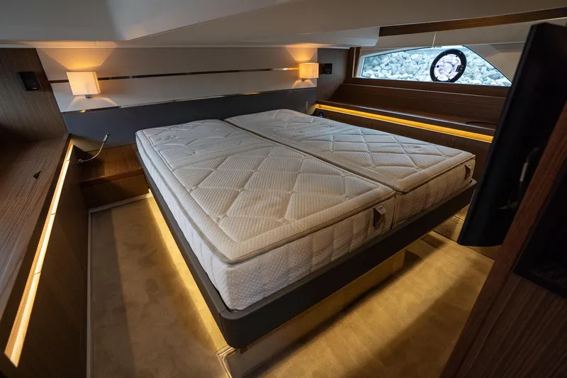  Yacht Photos Pics Luxurious bedroom interior of 2021 Sealine F430 yacht with modern lighting and elegant design.