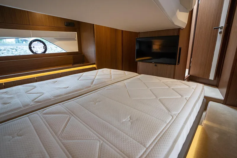  Yacht Photos Pics Luxurious cabin interior of 2021 Sealine F430 yacht with modern amenities.