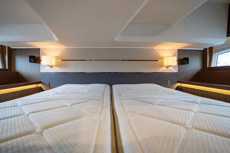  Yacht Photos Pics Luxurious interior cabin of 2021 Sealine F430 yacht with twin beds and modern lighting.