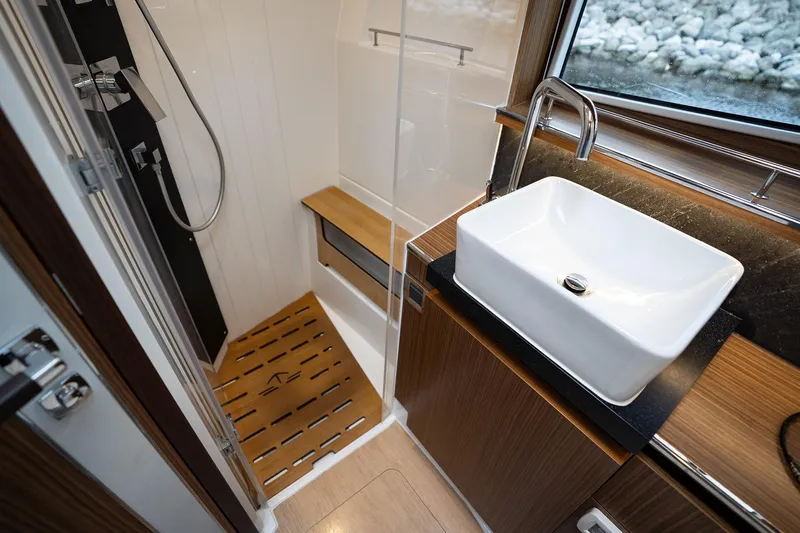  Yacht Photos Pics Luxurious bathroom in 2021 Sealine F430 yacht with modern sink and shower.