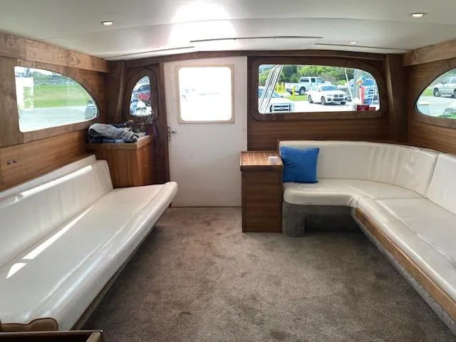 Waverunner Yacht Photos Pics Interior of 2022 Custom Carolina Sportfish boat with white seating and wood accents.