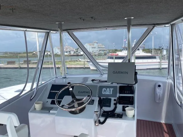 Waverunner Yacht Photos Pics Helm station of 2022 Custom Carolina Sportfish boat with Garmin electronics.