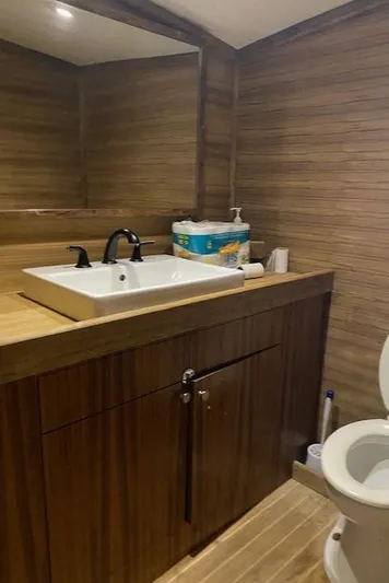 Waverunner Yacht Photos Pics 2022 Custom Carolina Sportfish bathroom with modern wood finish and sink.