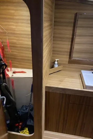 Waverunner Yacht Photos Pics 2022 Custom Carolina Sportfish interior with wooden cabinetry and sink.